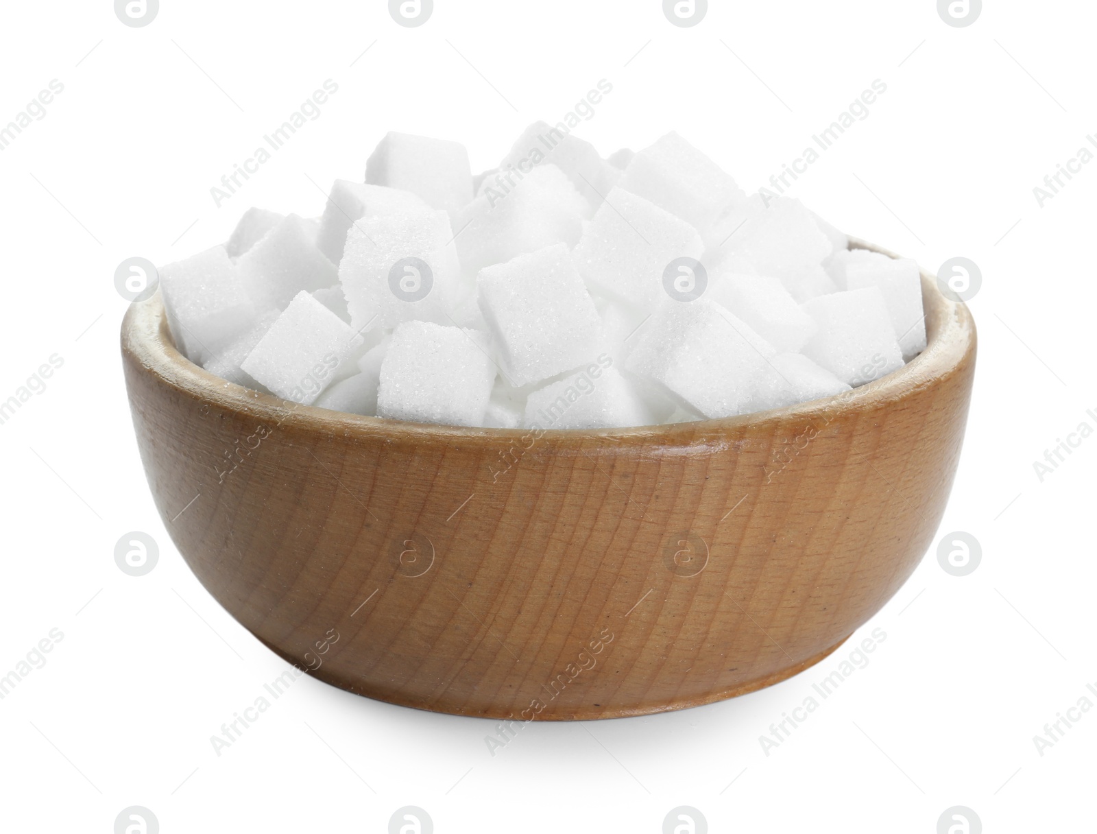 Photo of Sugar cubes in wooden bowl isolated on white