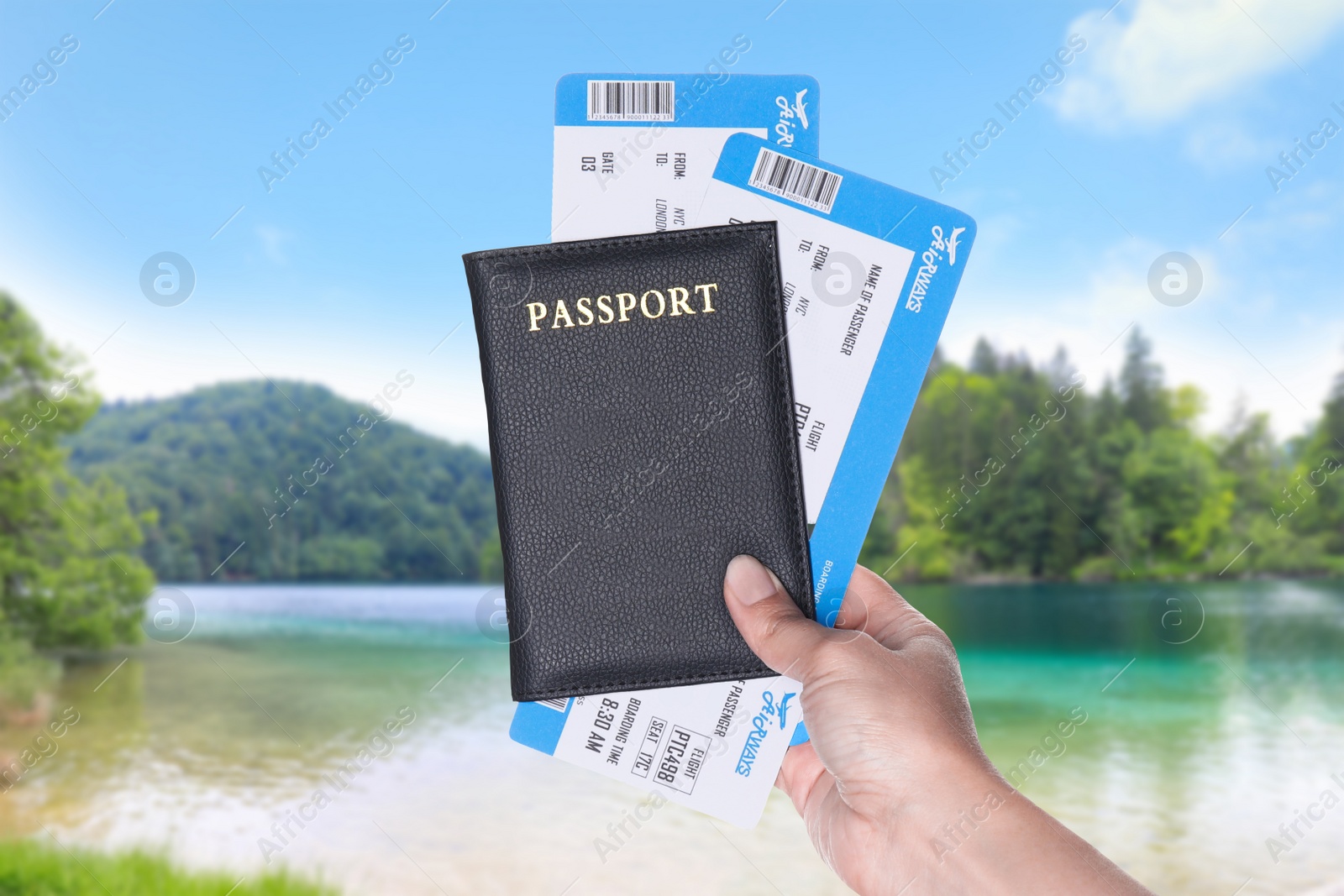 Image of Woman holding passport with tickets and beautiful view of river on background