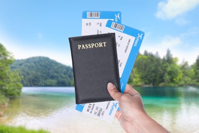 Image of Woman holding passport with tickets and beautiful view of river on background