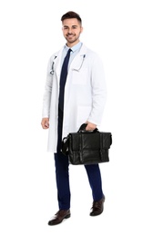 Full length portrait of medical doctor with bag isolated on white