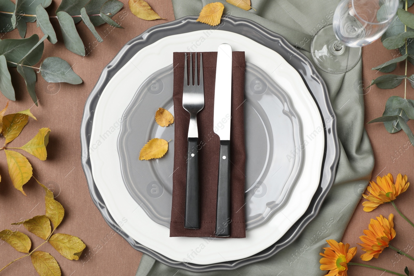 Photo of Beautiful autumn place setting and decor for festive dinner on table, flat lay