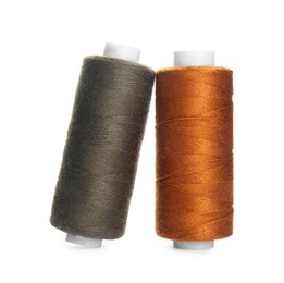 Photo of Different colorful sewing threads on white background