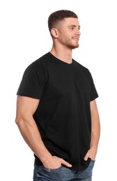 Man wearing black t-shirt on white background. Mockup for design