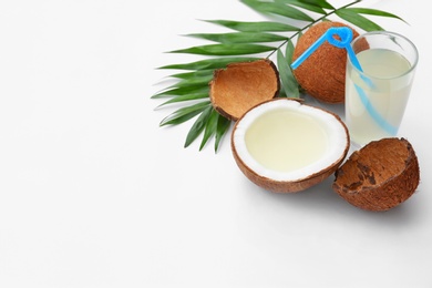 Photo of Composition with coconuts and drink on white background