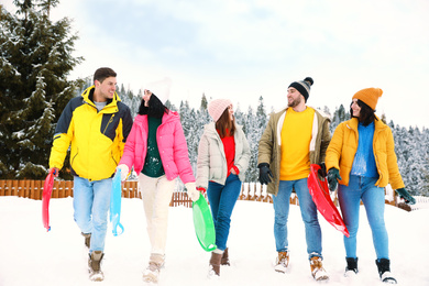 Photo of Group of friends outdoors on snowy day. Winter vacation