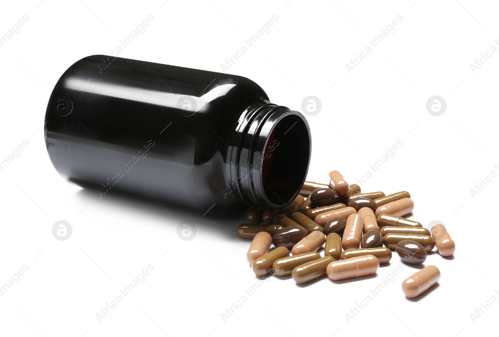 Photo of Bottle with vitamin capsules on white background