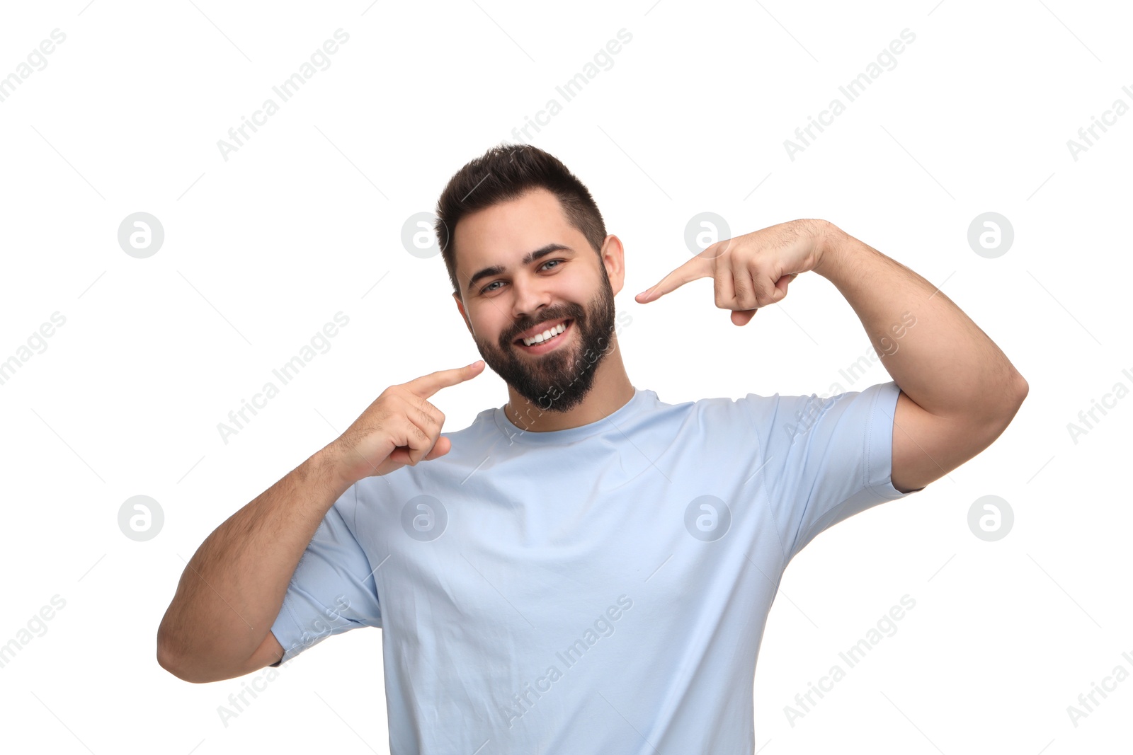 Photo of Man showing his clean teeth and smiling on white background