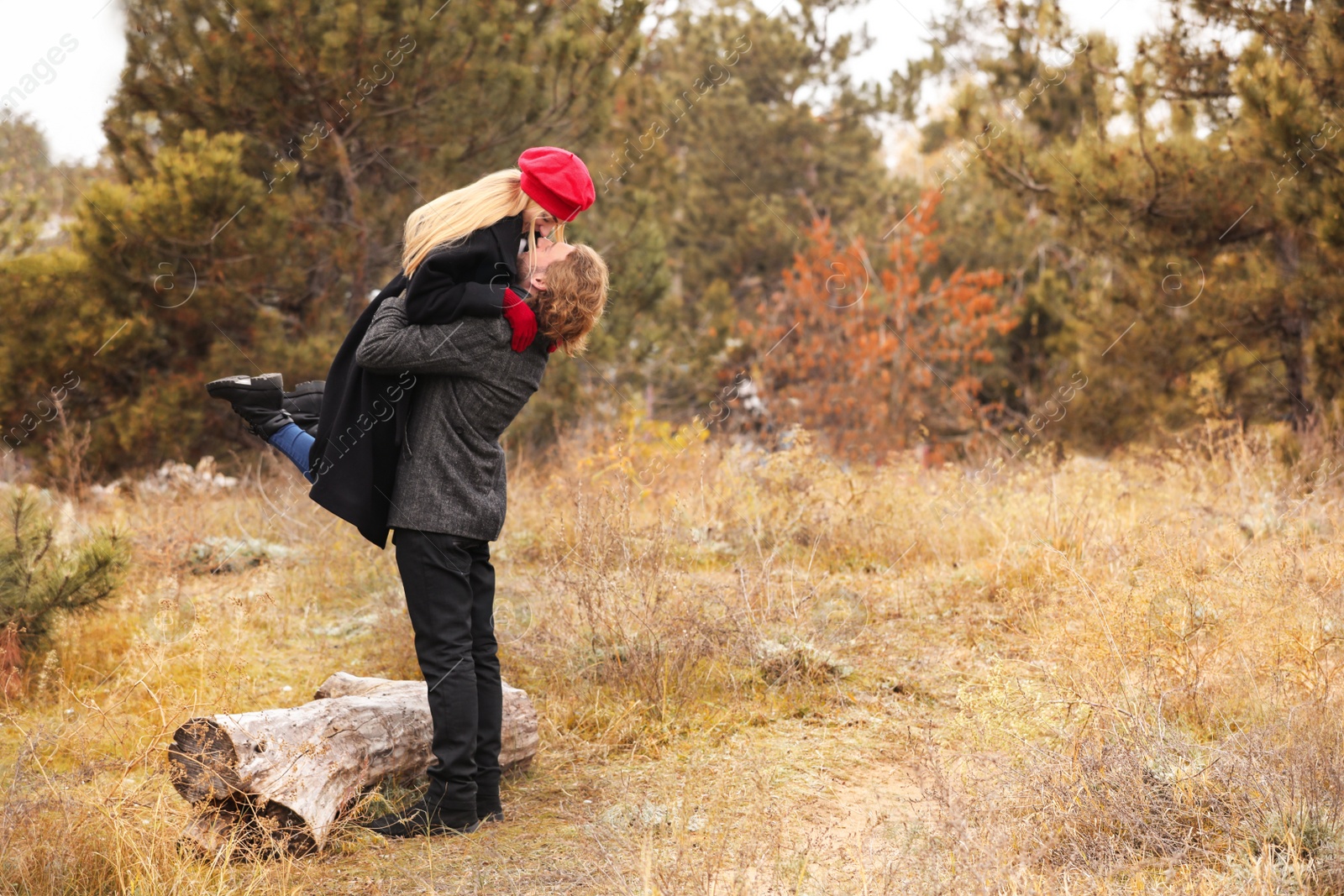 Photo of Romantic couple having fun in park on autumn day