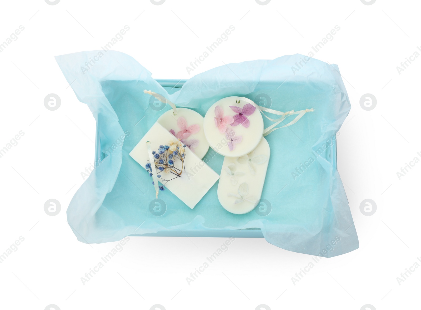 Photo of Beautiful scented sachets in box on white background, top view