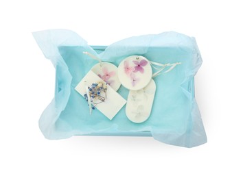 Photo of Beautiful scented sachets in box on white background, top view