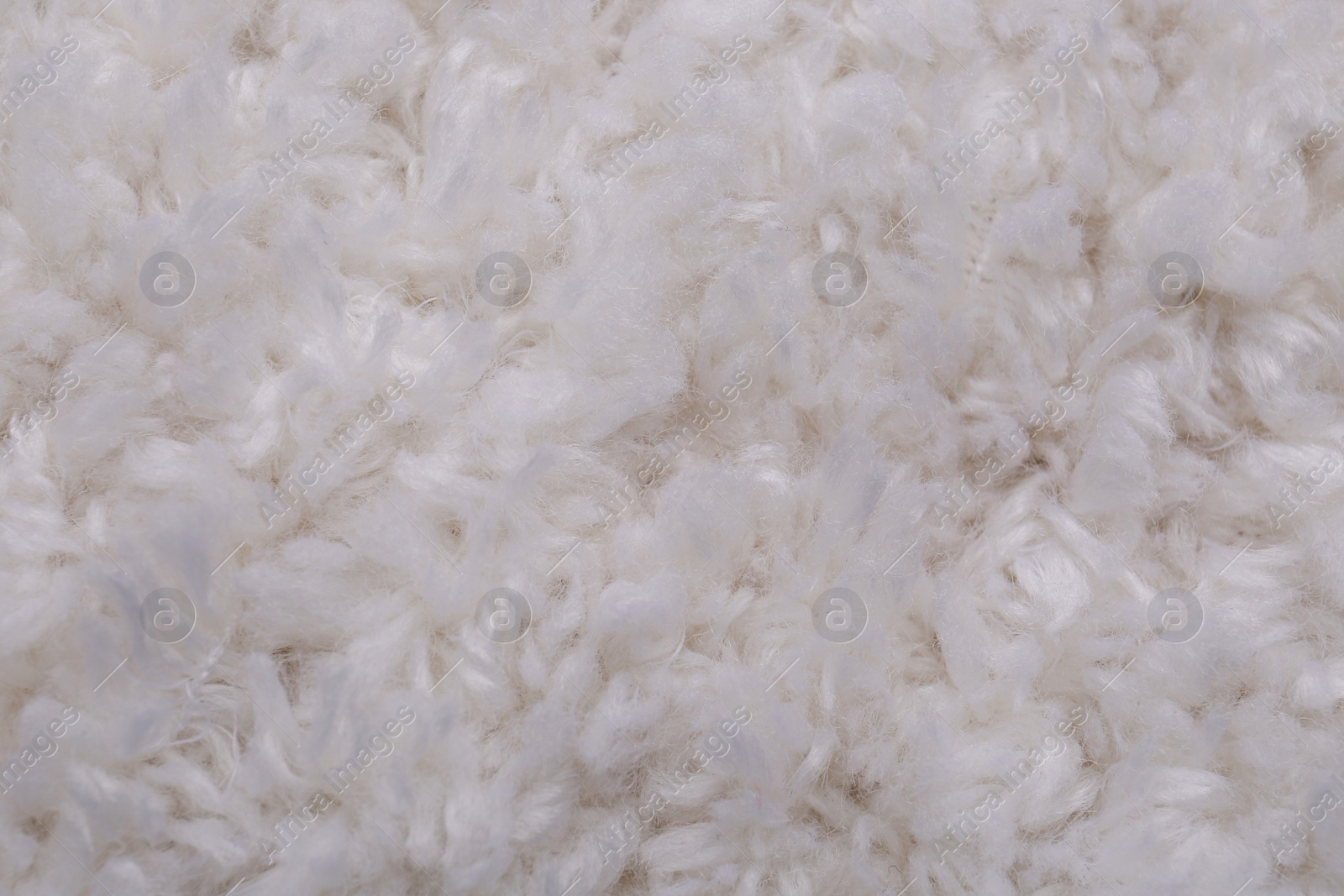 Photo of Soft white knitted fabric as background, top view