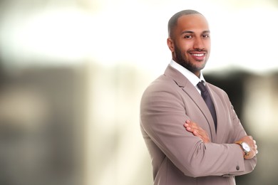 Lawyer, consultant, business owner. Confident man smiling indoors, space for text