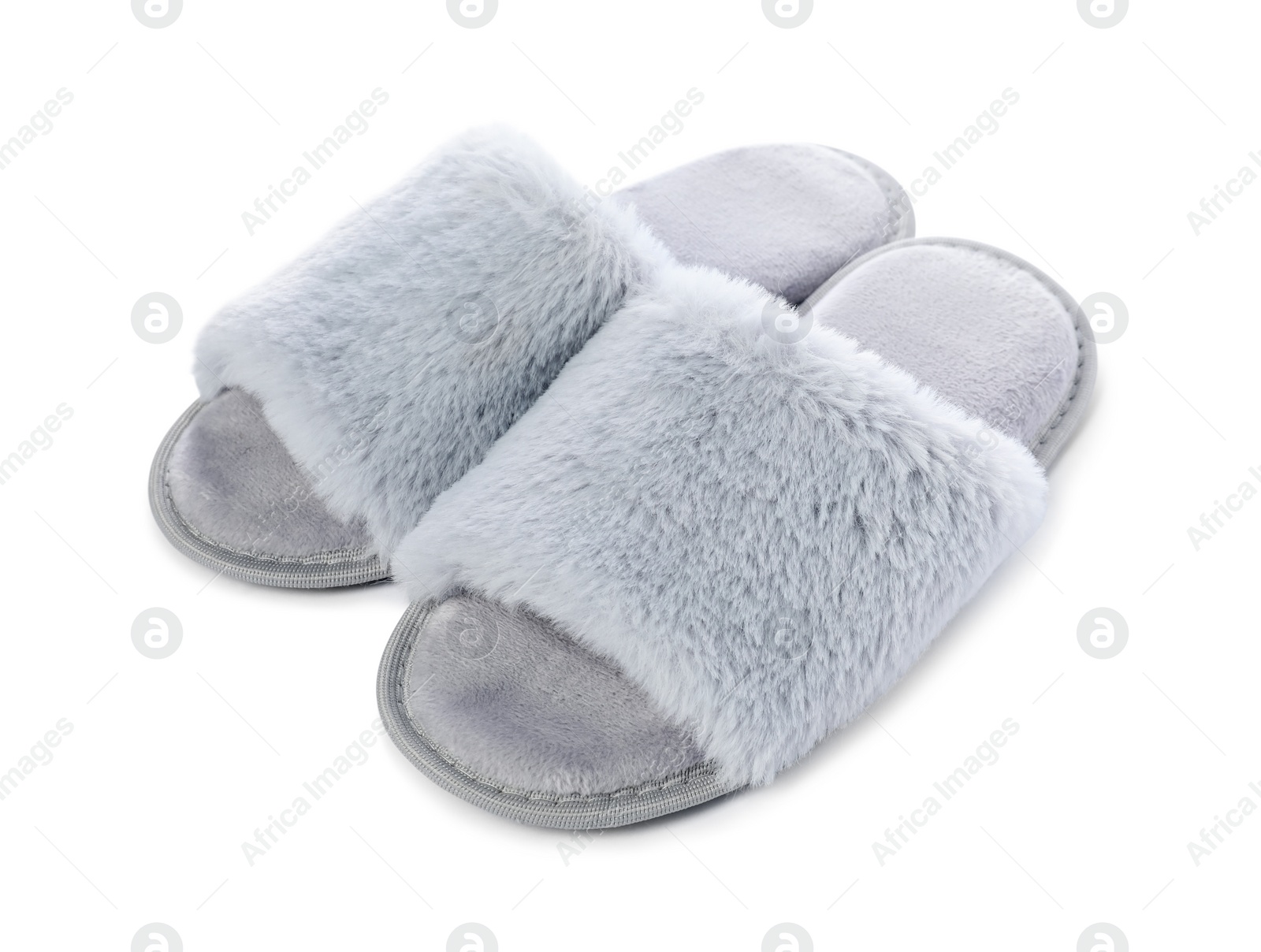 Photo of Pair of soft slippers with fur isolated on white