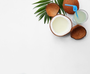 Photo of Composition with drink and coconuts on white background, top view