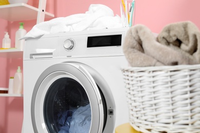 Modern washing machine in laundry room, closeup