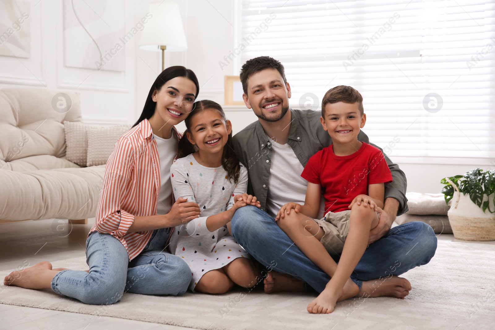 Photo of Portrait of happy family in living room. Adoption concept