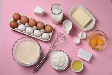 Photo of Flat lay composition with whisk and dough in bowl on pink background