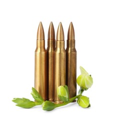 Photo of Bullets and beautiful flowers isolated on white