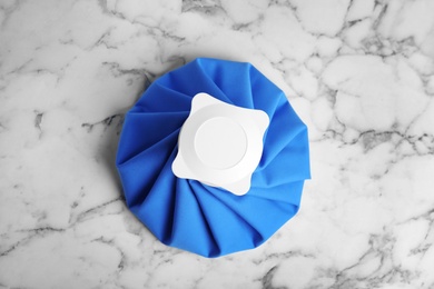 Ice pack on marble table, top view