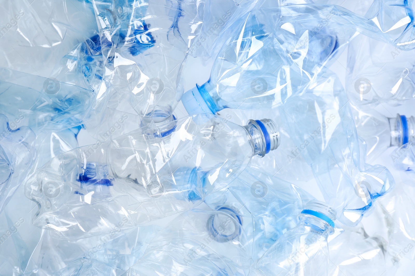 Photo of Many used plastic bottles as background, top view. Recycling problem