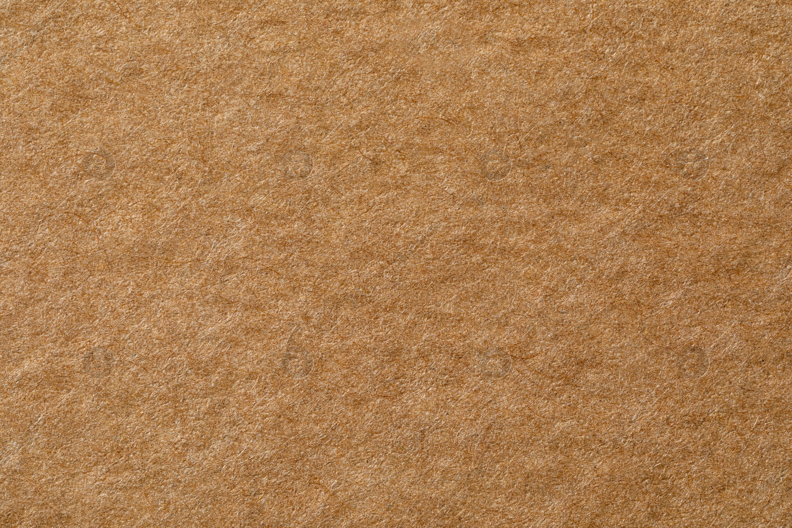 Photo of Texture of kraft paper sheet as background, closeup