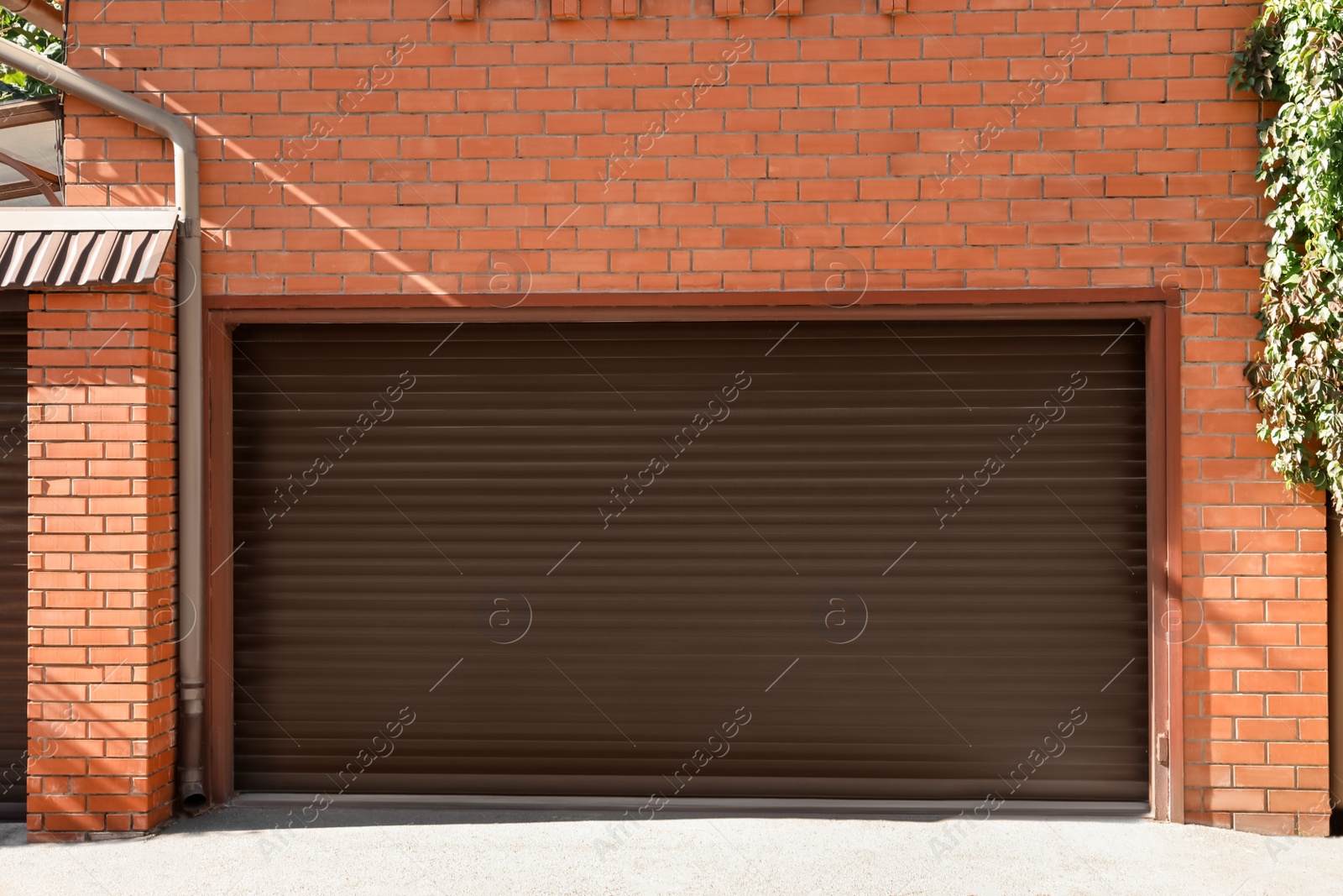 Photo of Brown modern roller garage doors on building