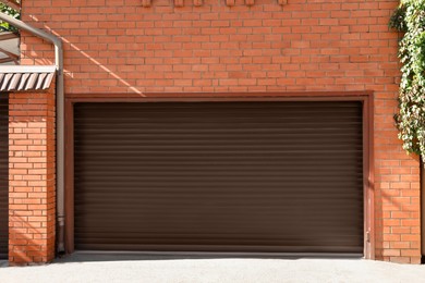 Photo of Brown modern roller garage doors on building