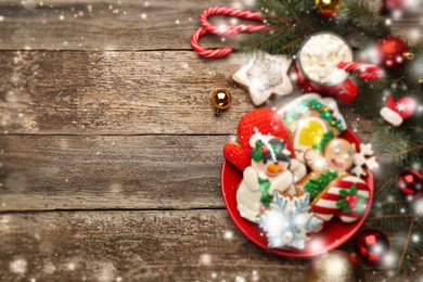 Image of Delicious Christmas cookies, cocoa and festive decor on wooden table, flat lay. Space for text