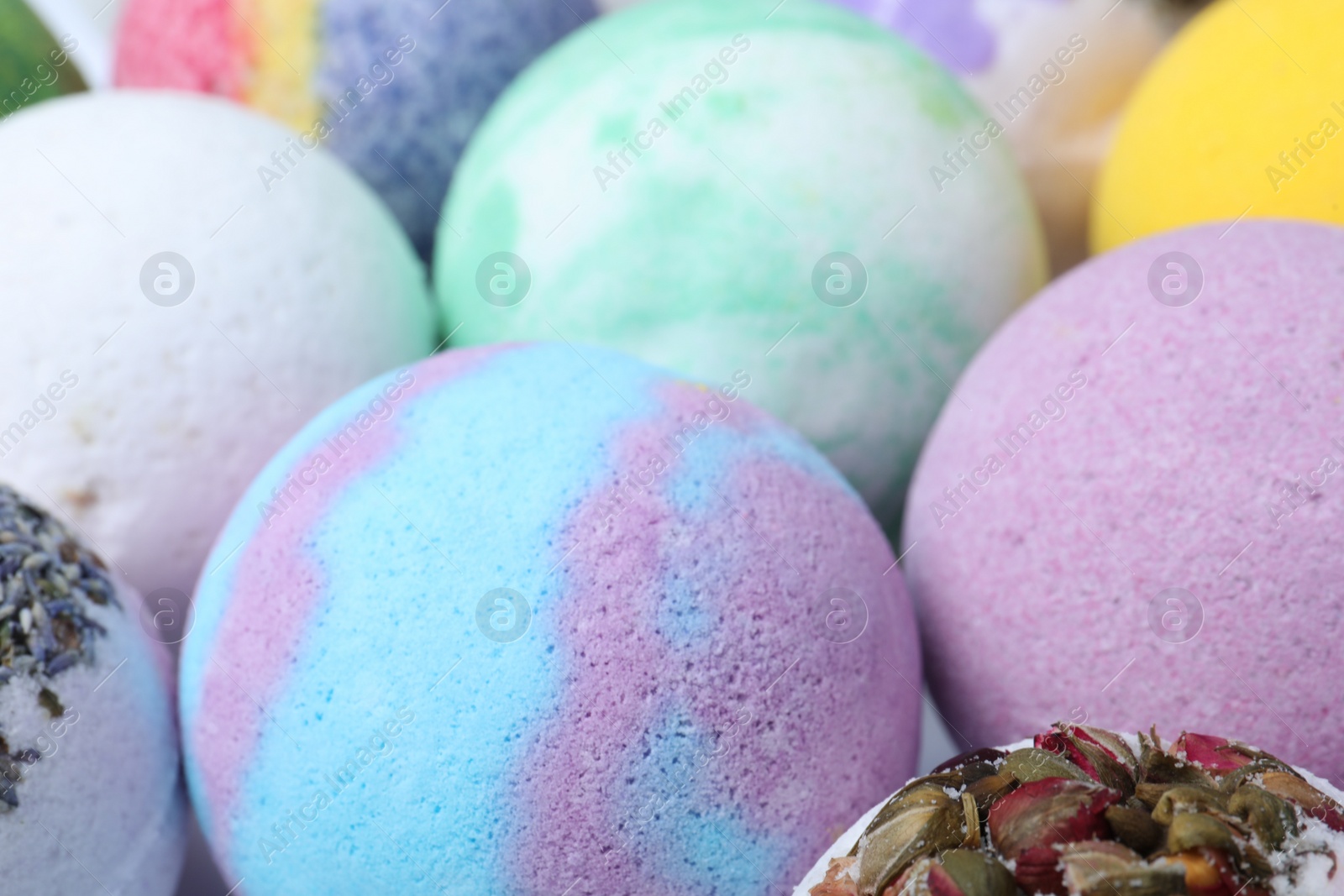 Photo of Colorful bath bombs as background, closeup view