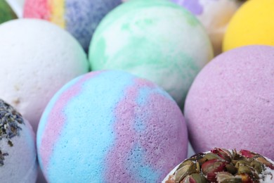 Photo of Colorful bath bombs as background, closeup view