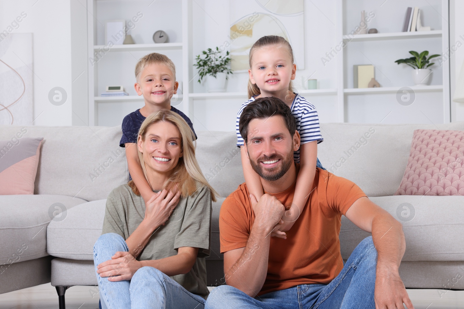 Photo of Portrait of happy family with children at home
