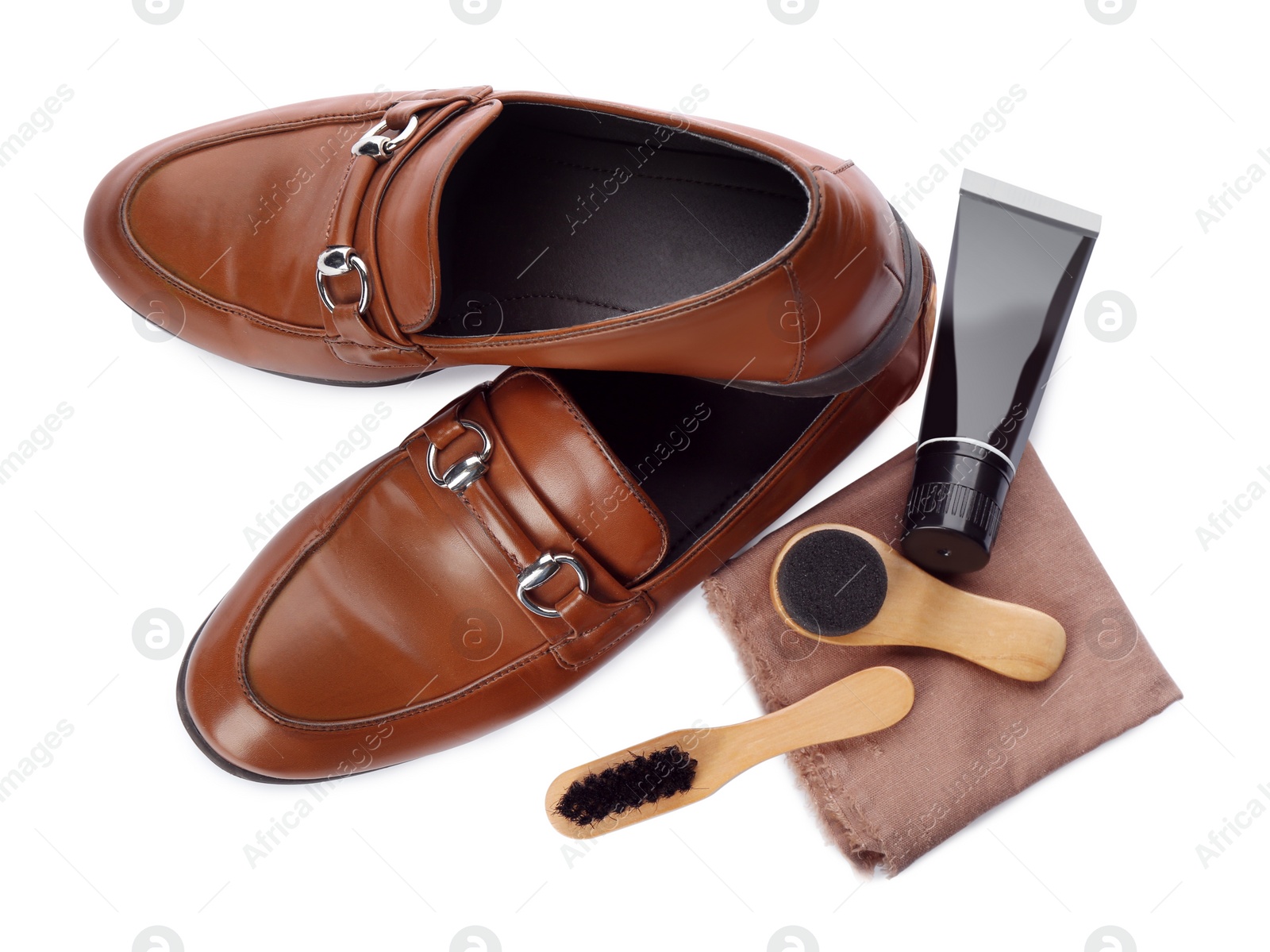 Photo of Stylish footwear and shoe care products on white background, top view