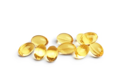 Cod liver oil pills on white background