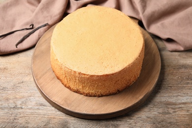 Delicious fresh homemade cake on wooden table