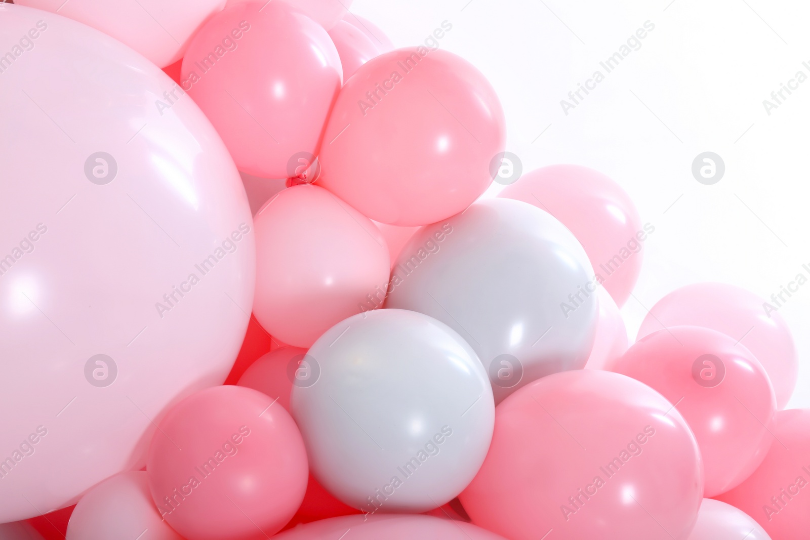 Photo of Beautiful colorful balloons on white background, closeup