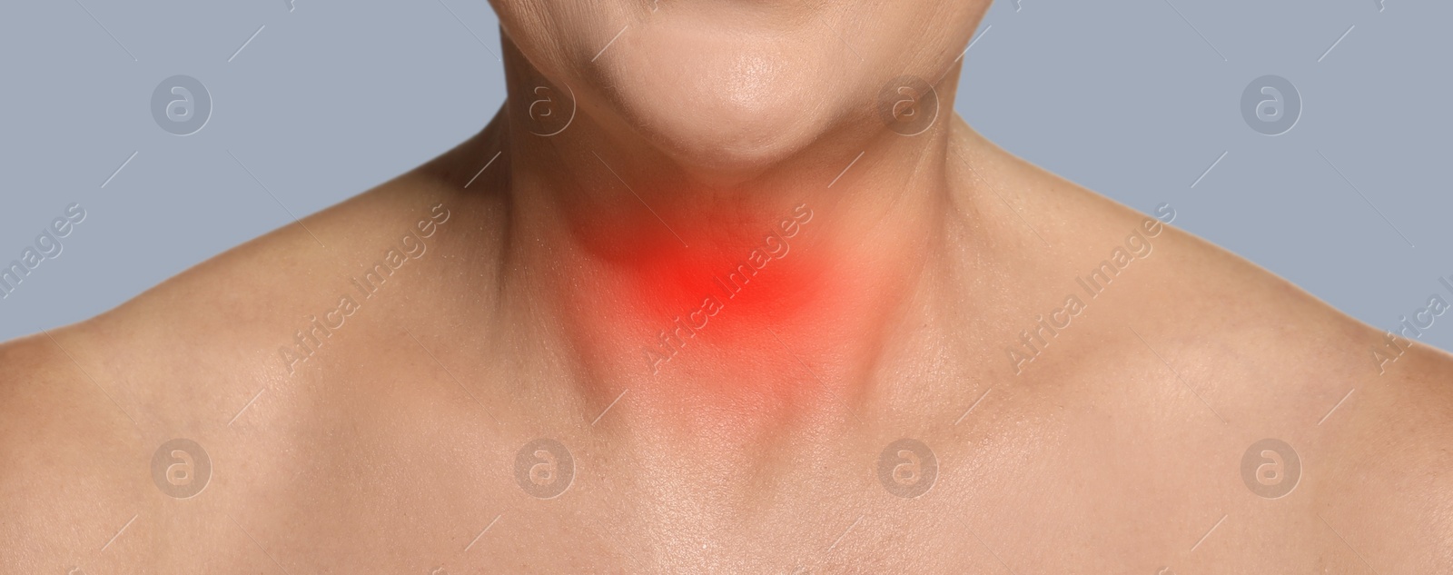 Image of Endocrine system. Woman suffering from pain in thyroid gland on grey background, closeup. Banner design