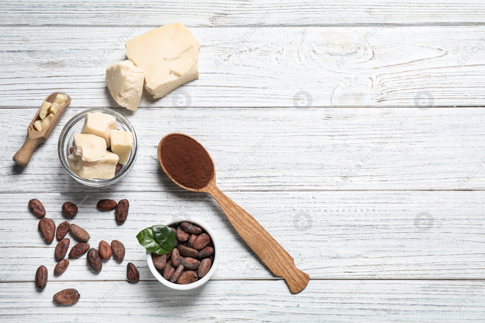 Photo of Flat lay composition with organic cocoa butter on white wooden table. Space for text