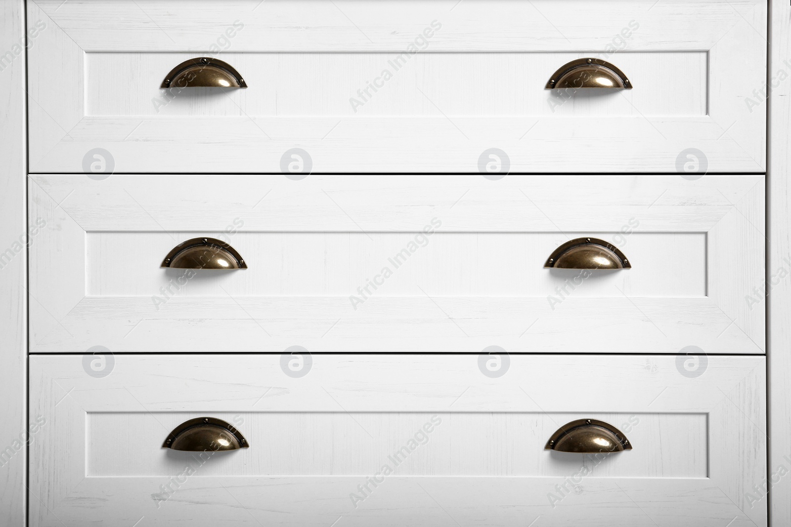 Photo of White wardrobe drawers as background, closeup view