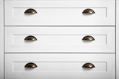 Photo of White wardrobe drawers as background, closeup view