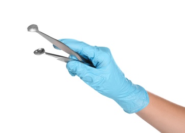 Photo of Doctor in sterile glove holding medical forceps on white background