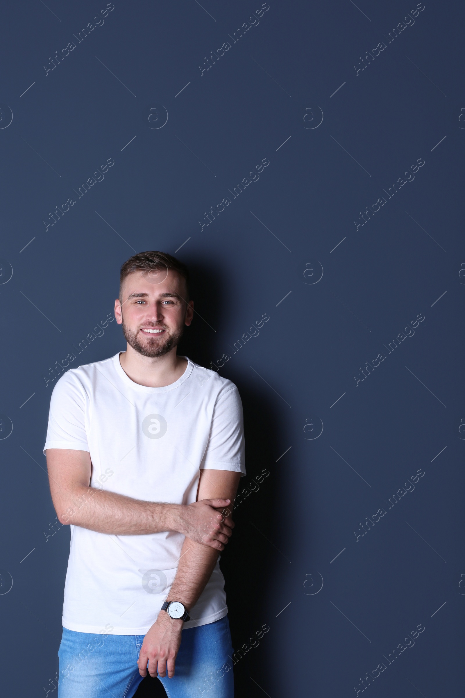 Photo of Portrait of handsome happy man on grey background, space for text