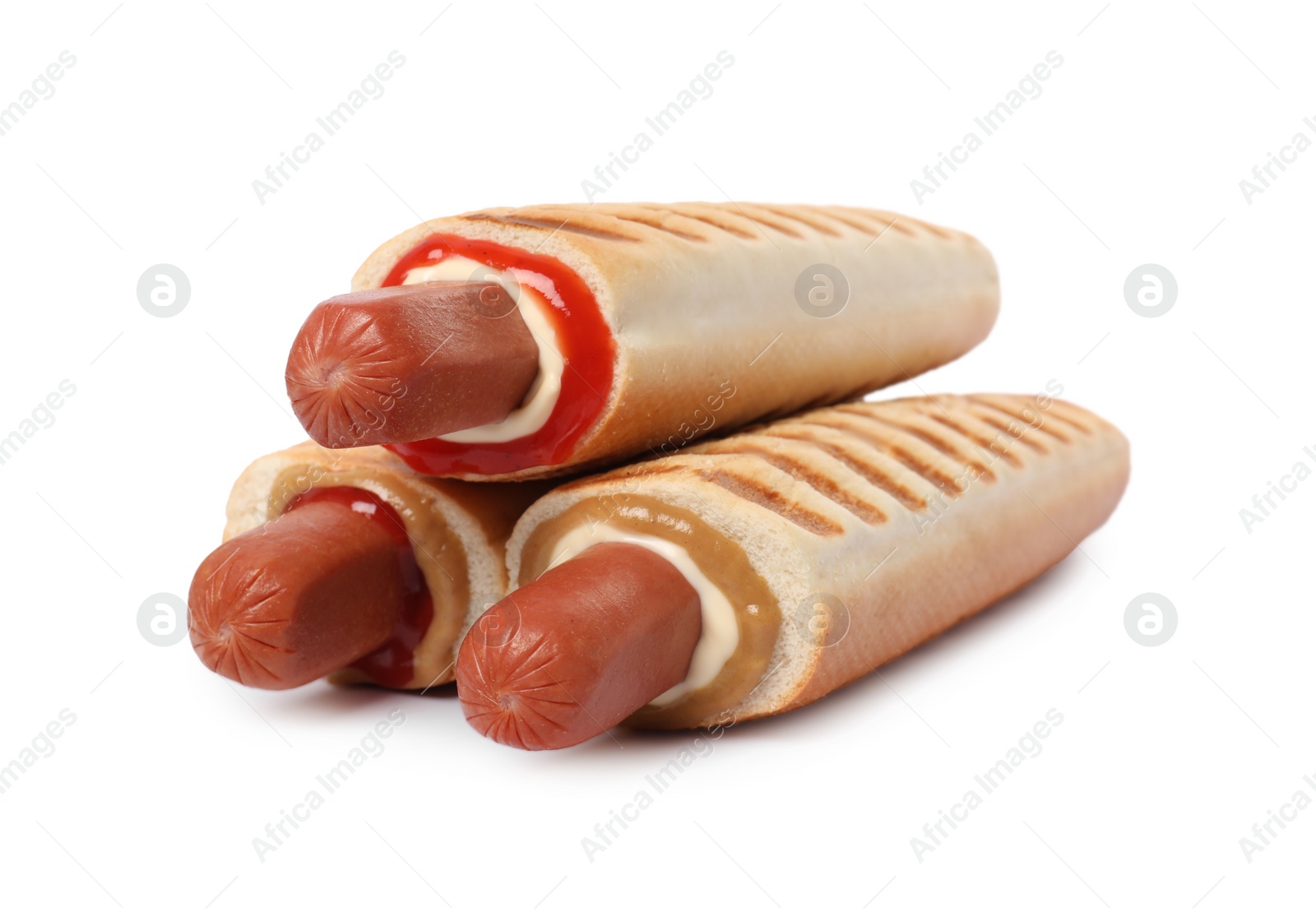 Photo of Tasty french hot dogs with different sauces on white background