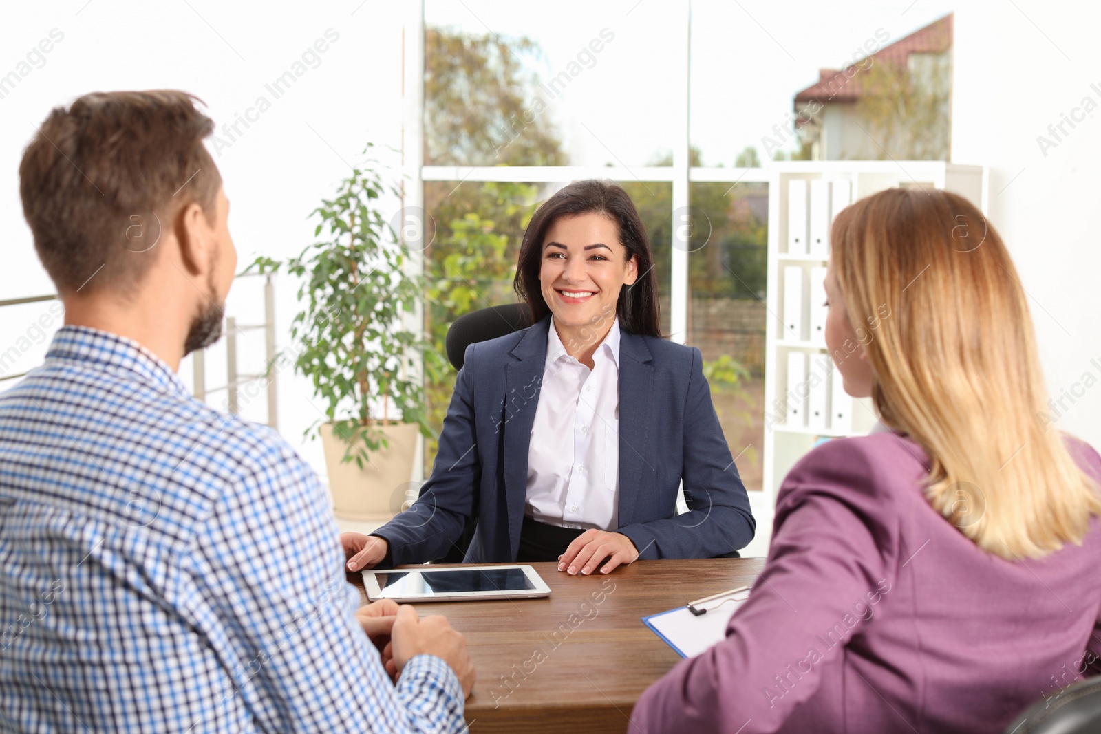 Photo of Human resources manager conducting job interview with applicants in office