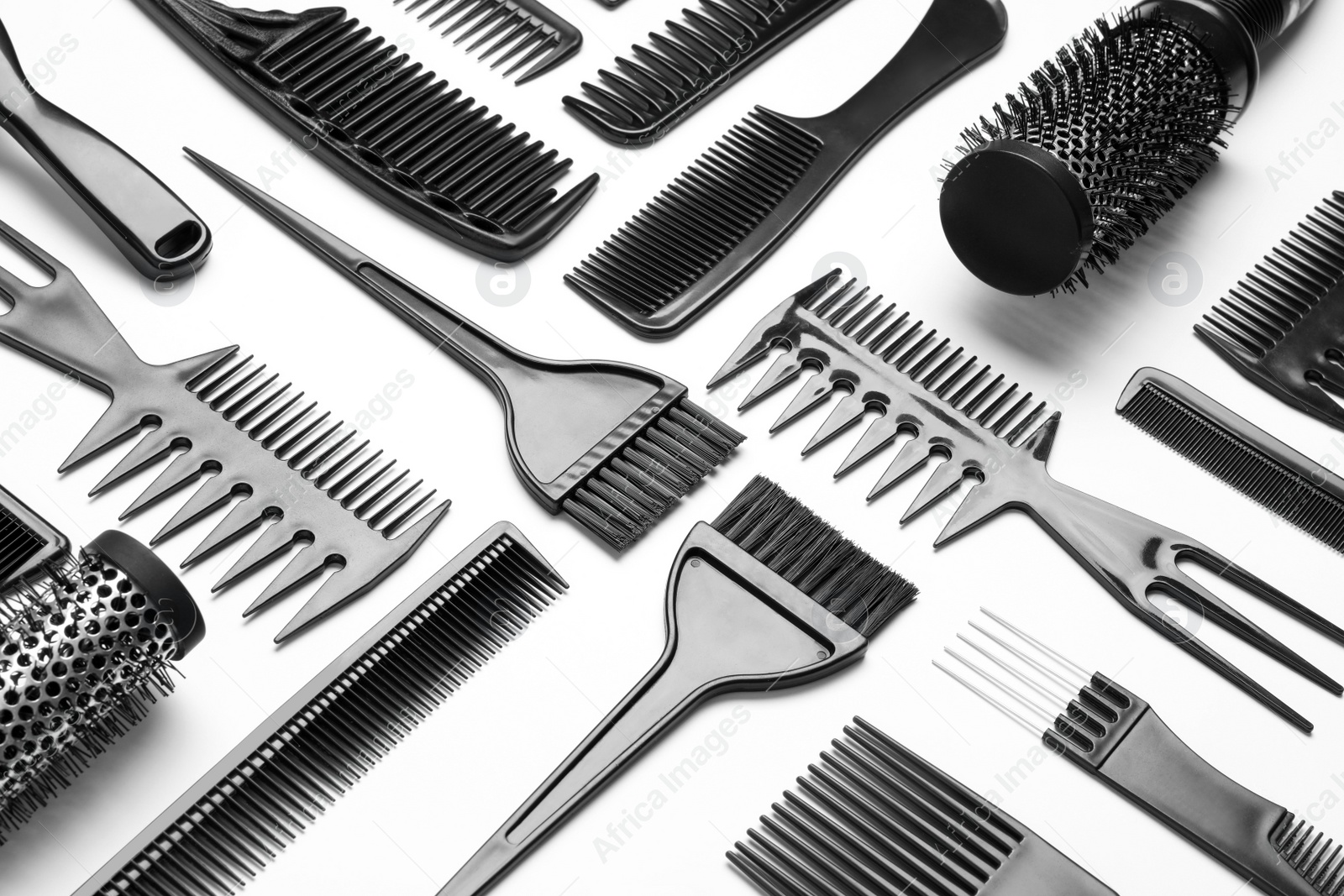 Photo of Composition with hair combs and brushes on white background