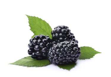 Tasty ripe blackberries with green leaves on white background