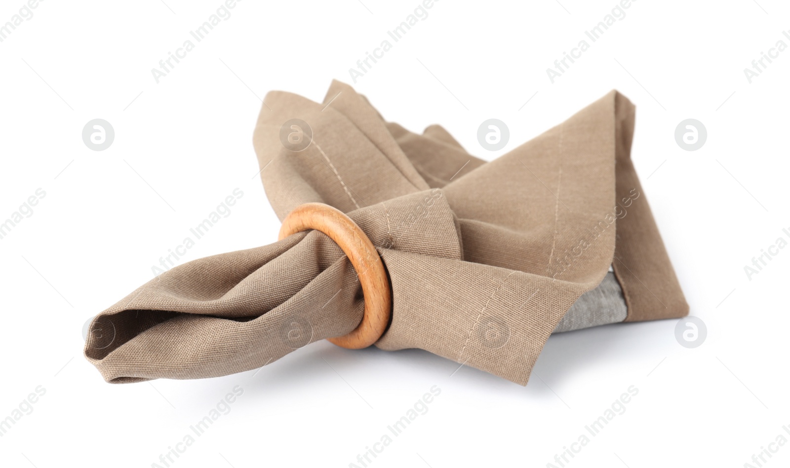 Photo of Fabric napkin with decorative ring for table setting on white background