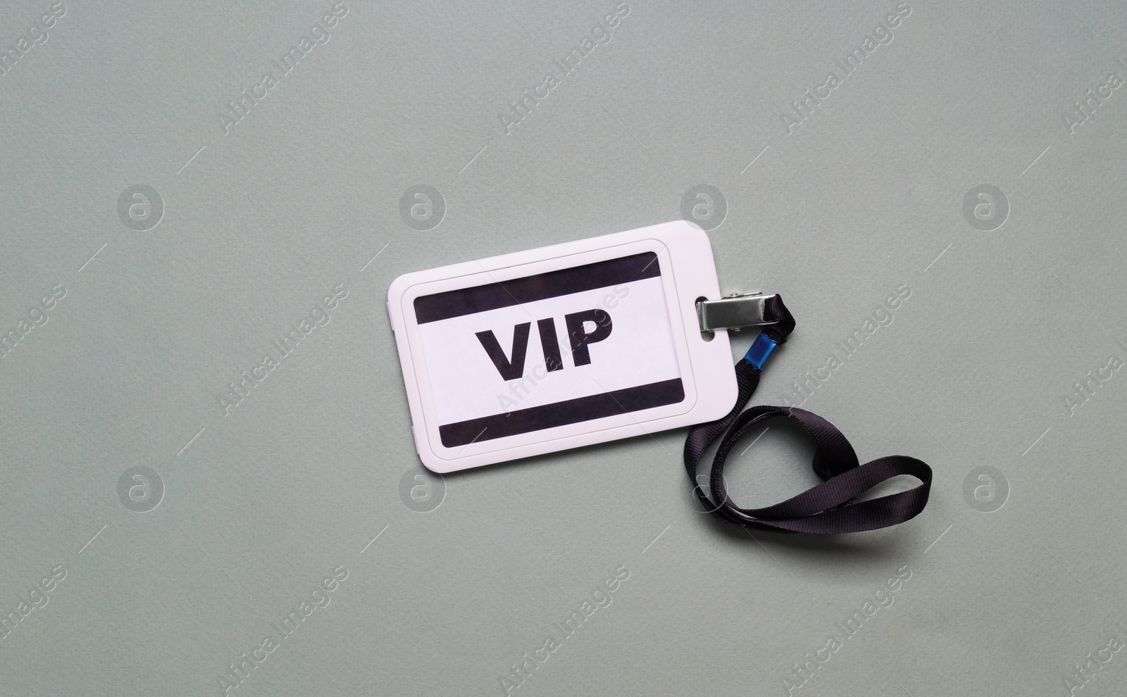 Photo of Plastic vip badge on light gray background, top view