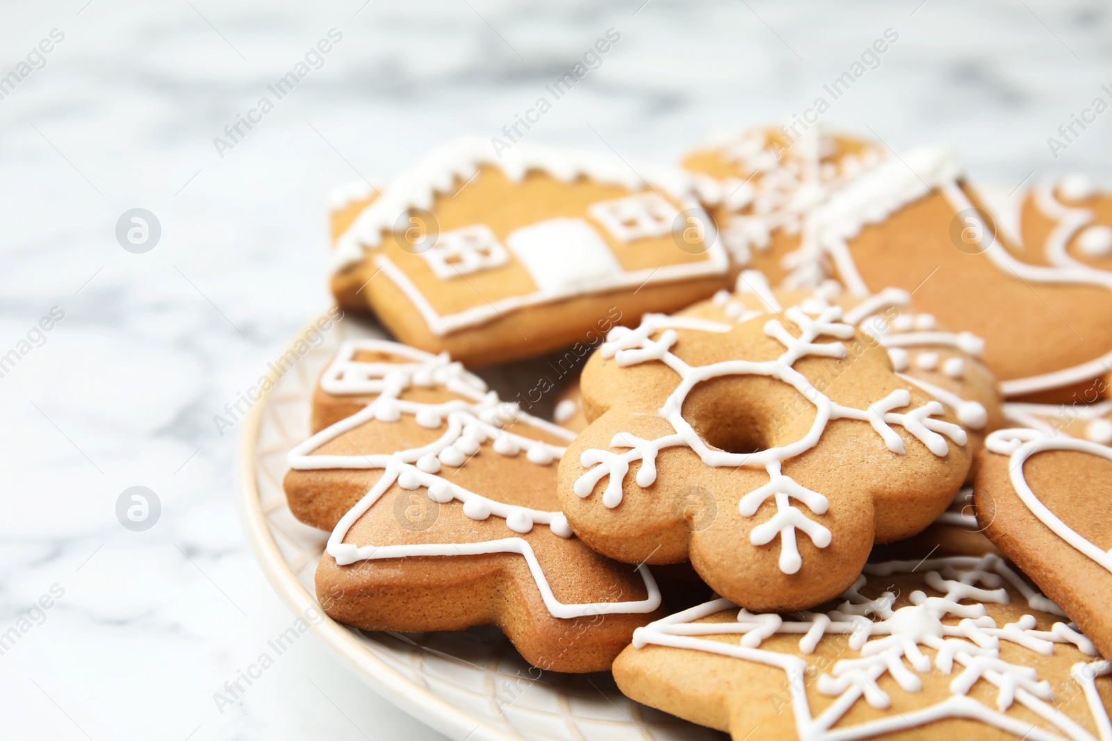 Photo of Plate with tasty homemade Christmas cookies, closeup