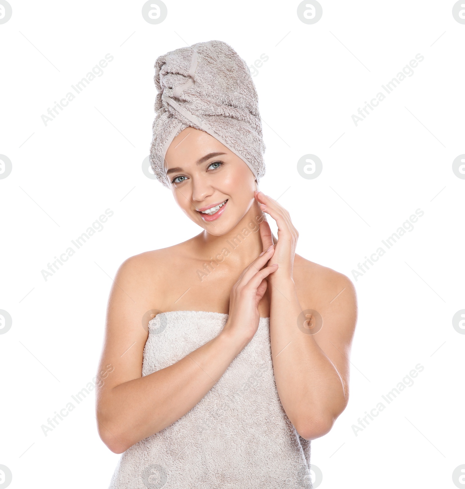 Photo of Portrait of young pretty woman with towels on white background