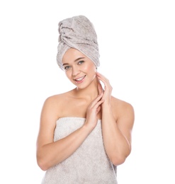 Portrait of young pretty woman with towels on white background